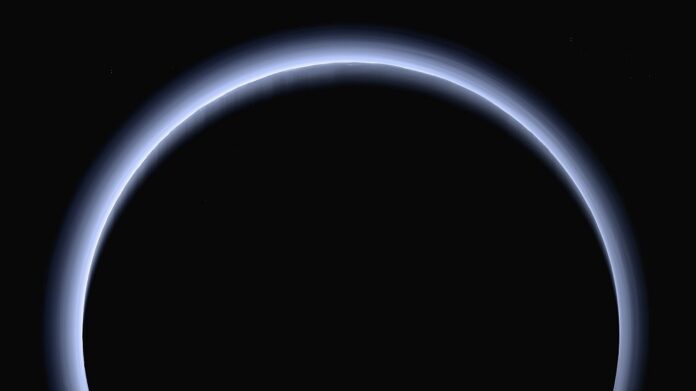 This image made available by NASA in March 2017 shows Pluto illuminated from behind by the sun as the New Horizons spacecraft travels away from it at a distance of about 120,000 miles (200,000 kilometers). (NASA/Johns Hopkins University Applied Physics Laboratory/Southwest Research Institute via AP)