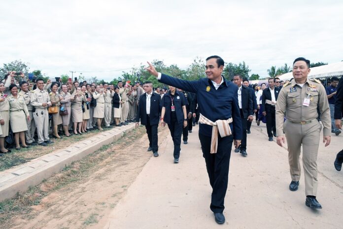 Junta chairman Prayuth Chan-ocha greets residents of Bueng Kan province with an