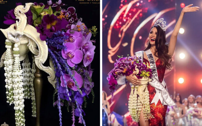 Catriona Gray holds a bouquet designed by Thai florist Phiyawat Meephaithoon, right, upon winning Miss Universe 2018 on Monday.