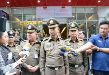 Lumpini Cop Shoots Frenchman to Death After Brawl: Police Flanked by two senior officers, Maj. Gen. Surachate Hakparn speaks to reporters at the scene where a French national was shot to death by a Bangkok police officer.