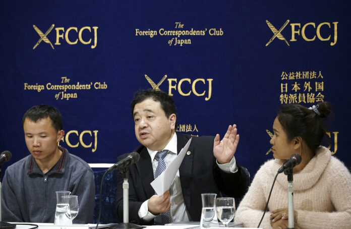 Lawyer Shoichi Ibusuki, center, speaks in November during a press conference in Tokyo, on the problems in Japan's technical intern program, with Eng Pisey, right, Cambodian technical trainee and Huang Shihu, left, Chinese technical trainee in Tokyo. Photo: Eugene Hoshiko / Associated Press Lawyer Shoichi Ibusuki, center, speaks in November during a press conference in Tokyo, on the problems in Japan's technical intern program, with Eng Pisey, right, Cambodian technical trainee and Huang Shihu, left, Chinese technical trainee in Tokyo. Photo: Eugene Hoshiko / Associated Press
