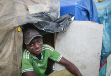 Nearly 85 Percent of UN Nations Back Migration Deal; Not US Wazzizi, a sub-Saharan migrant from Guinea, sits Thursday outside the tent where he lives at at Ouled Ziane camp in Casablanca, Morocco. Photo: Mosa'ab Elshamy / Associated Press