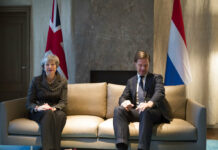 May in the Netherlands as She Fights to Save Brexit Deal British Prime Minister Theresa May, left, and Dutch Prime Minister Mark Rutte pose for photographers at the start of a meeting Tuesday in The Hague, Netherlands. Photo: Peter Dejong / Associated Press