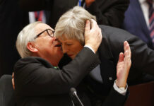 UK, EU Announce Change to Brexit Deal Ahead of Key Vote European Commission President Jean-Claude Juncker, left, greets British Prime Minister Theresa May during a round table meeting in December at an EU summit in Brussels, Belgium. Photo: Alastair Grant / Associated Press