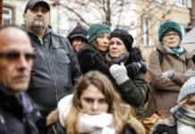 France: Alleged Gun Source Given Preliminary Extremism Charges Residents react Sunday during a gathering being held in a central square of the eastern French city of Strasbourg. Photo: Jean-Francois Badias / Associated Press