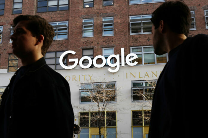 People walk by Google offices in 2017 in New York. Photo: Mark Lennihan / Associated Press People walk by Google offices in 2017 in New York. Photo: Mark Lennihan / Associated Press