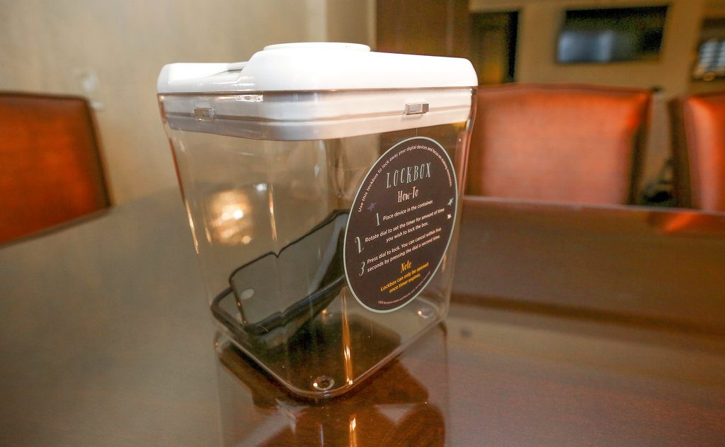 A locked box holding cell phones during a Dec. 1 digital detox visit to the Wyndham Grand Hotel in Chicago. Photo: Teresa Crawford / Associated Press