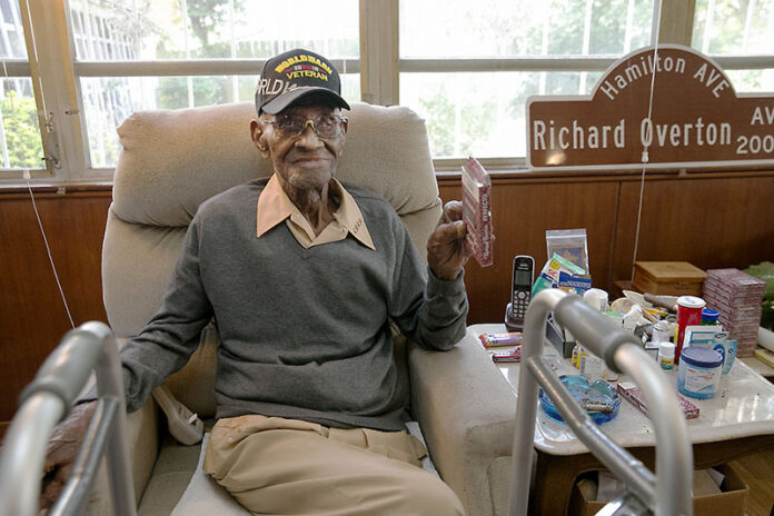 Richard Overton, the oldest living U.S. Veteran at the age of 111, sits May 10, 2018, in the east Austin home he owned since 1948 after a renovation provided by Meals on Wheels of Central Texas and the Home Depot Foundation. Photo: Ralph Barrera / Austin American-Statesman Richard Overton, the oldest living U.S. Veteran at the age of 111, sits May 10, 2018, in the east Austin home he owned since 1948 after a renovation provided by Meals on Wheels of Central Texas and the Home Depot Foundation. Photo: Ralph Barrera / Austin American-Statesman