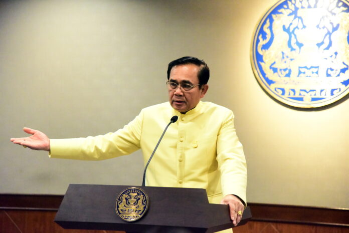 Gen. Prayuth Chan-ocha speaks to reporters Tuesday at the Government House.