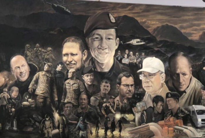 A mural depicting those who participated in the Luang Cave rescue operations.