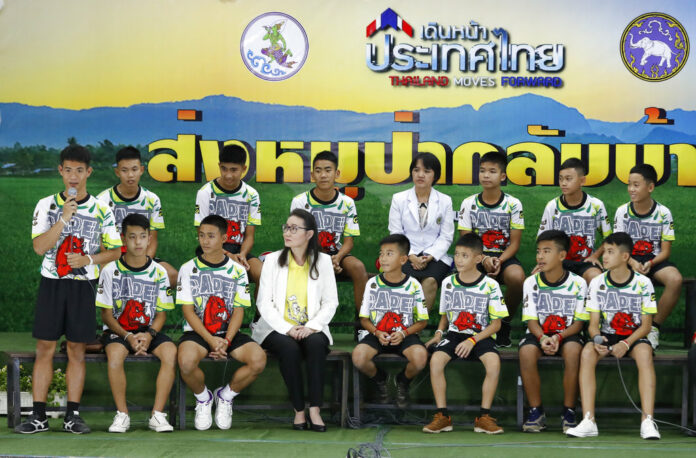 Coach 'Ake' Ekkapol Janthawong, at left, speaks July 18, 2018, on behalf of the 12 boys and himself about their rescue from a flooded cave in Chiang Rai. Photo: Vincent Thian