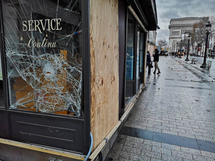 A photo of a vandalized shop Sunday in Paris, France.