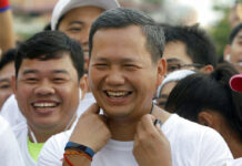 Is Hun Sen Grooming His Son to Lead Cambodia? Lt. Gen. Hun Manet, at center, of the Royal Cambodian Armed Forces and the first son of Prime Minister Hun Sen, smiles before the start of the international half-marathon in June 2016 in front of Royal Palace in Phnom Penh. He is now 41. Photo: Heng Sinith / Associated Press
