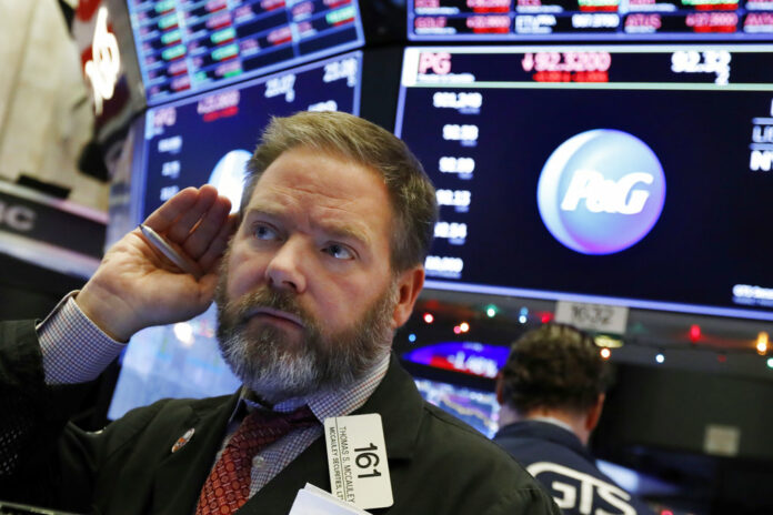 Trader Thomas McCauley works Thursday on the floor of the New York Stock Exchange. Photo: Richard Drew / Associated Press