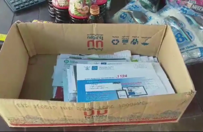 A box of undelivered mail left at Lamoon Takerdpol’s shop Monday in Buriram province.