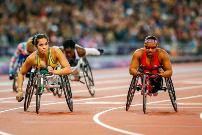 Madison de Rozario, left, races at the 2012 paralympic in London, England.