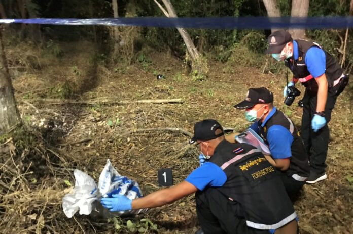 Police investigate a crime scene Monday where a dismembered body, later identified as a South Korean man, was found in Rayong province.
