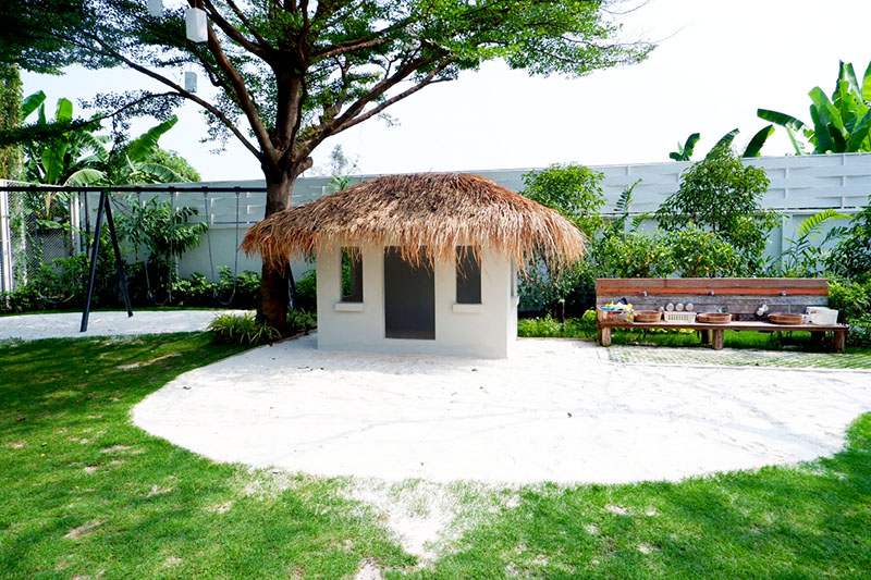 A miniature hut for children to play in.