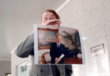 Family Alleges Foul Play in Phuket Death of British CEO Attorney Vincent McOwen holds up a photo of Steven James Granville on Friday at the Crime Suppression Division in Bangkok.