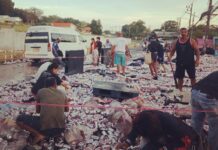 Brew Bandits: Crowd ‘Cleans Up’ 80,000 Cans of Leo on Phuket People pick up beer cans that fell from an overturned truck Friday in Phuket City. Photo: Mana Sombat / Facebook