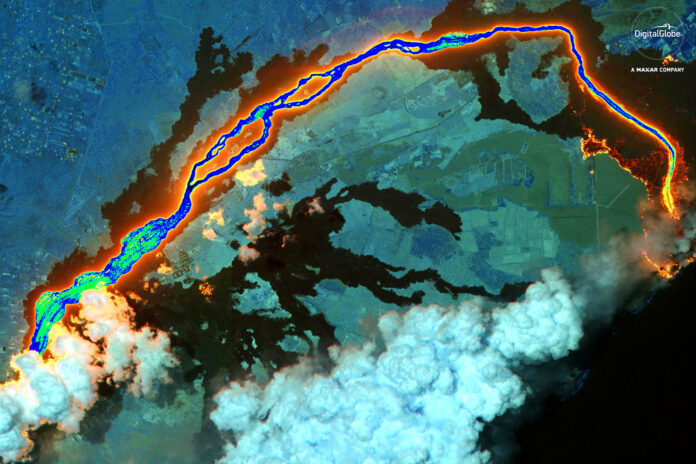 This June 26, 2018 satellite image provided by DigitalGlobe shows lava flows from the Kilauea volcano in Hawaii. Photo: DigitalGlobe, a Maxar company via AP