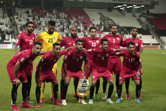 Yemen players pose for a picture Monday during the AFC Asian Cup group D soccer match between Iran and Yemen at the Mohammed Bin Zayed Stadium in Abu Dhabi, United Arab Emirates. Photo: Nariman El-Mofty / Associated Press