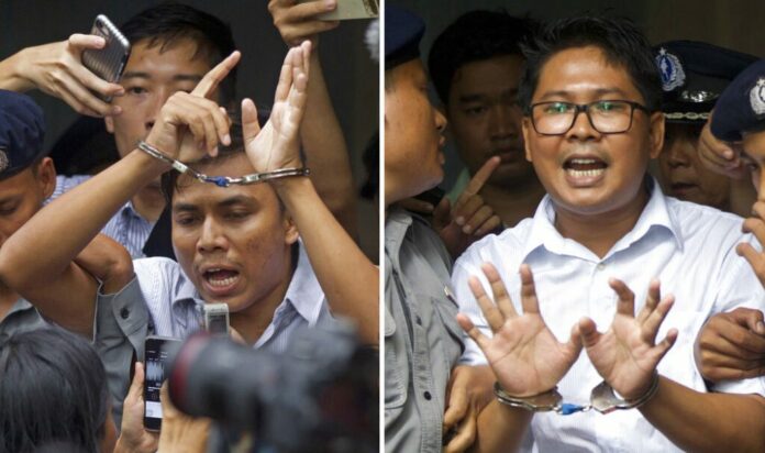 FILE - In this combination file image made from two photos, Reuters journalists Kyaw Soe Oo, left, and Wa Lone, are handcuffed as they are escorted by police out of the court in Yangon, Myanmar Sept. 3, 2018. Photo: Thein Zaw, File / Associated Press