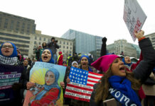 A Scaled-Down, But Still Angry, Women’s March Returns A group hold up signs at freedom plaza during the women's march in Washington on Saturday, Jan. 19, 2019. Photo: Jose Luis Magana / Associated Press