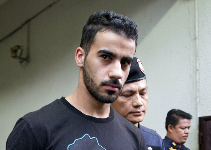 Prison guards escort Bahraini football player Hakeem AlAraibi in December from a court in Bangkok. Photo: Gemunu Amarasinghe / Associated Press