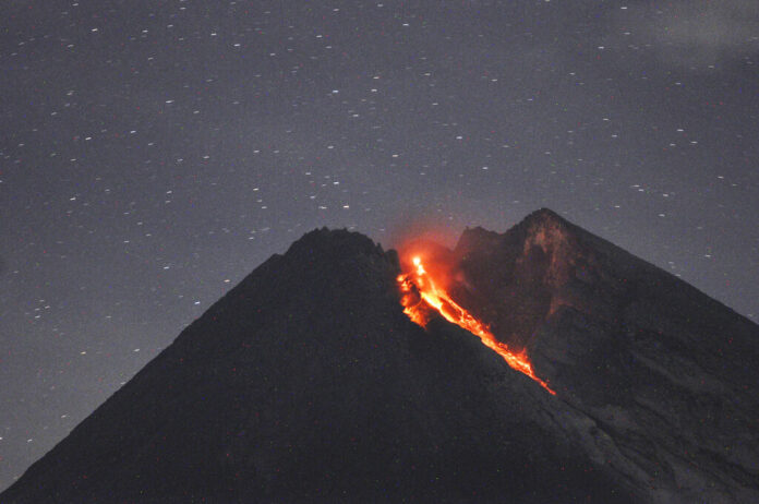 Mount Merapi spews volcanic material as it erupts as seen Tuesday from Cangkringan, Yogyakarta, Indonesia. Photo: Slamet Riyadi / Associated Press Mount Merapi spews volcanic material as it erupts as seen Tuesday from Cangkringan, Yogyakarta, Indonesia. Photo: Slamet Riyadi / Associated Press