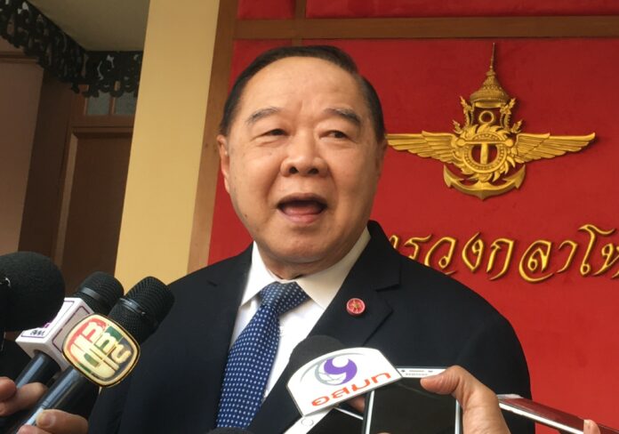 Gen. Prawit Wongsuwan talks to reporters Wednesday at the Defense Ministry.