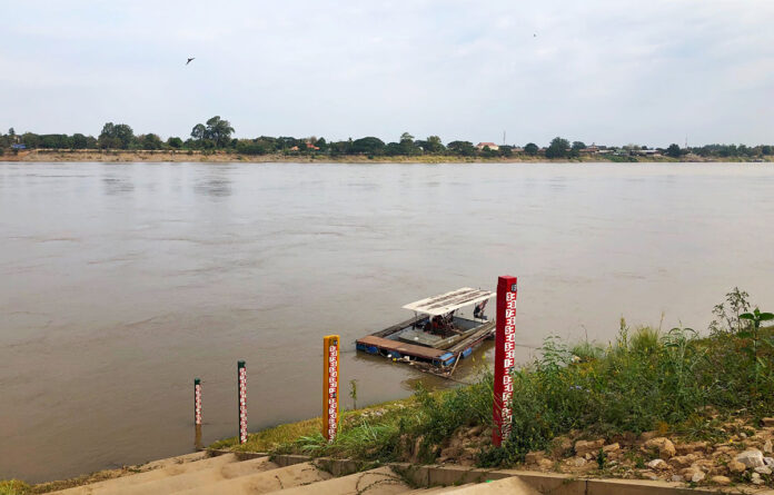 Posts mark water levels in the Mekong River on Jan. 15 in Nong Khai province.