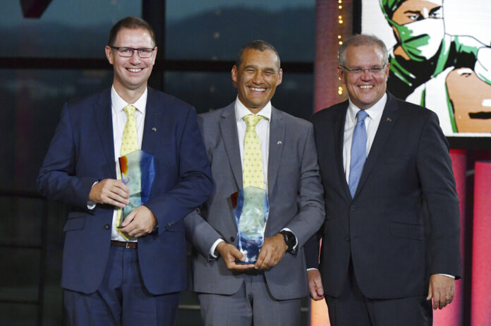 Australian Prime Minister Scott Morrison, at right, stands with Richard Harris, at left, and Craig Challen at the 2019 Australian of the Year Awards on Friday in Canberra, Australia. Photo: Mick Tsikas / AAP Image via AP