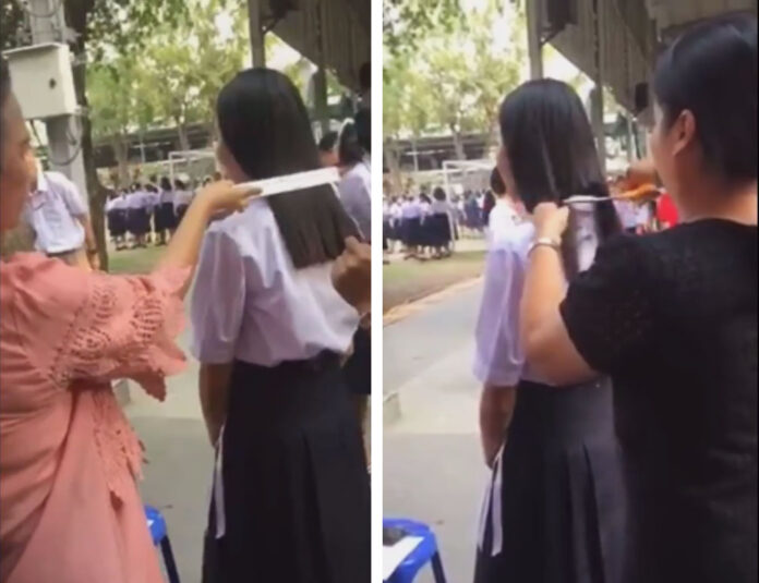 Kanchananukroh School teachers cut the hair of a Matthayom 4 student on Jan. 10 in Kanchanaburi.