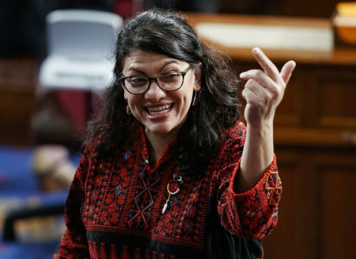 In this Thursday, Jan. 3, 2019 photo, then Rep.-elect Rashida Tlaib of Michigan, is shown on the house floor before being sworn into the 116th Congress at the U.S. Capitol in Washington. (AP Photo/Carolyn Kaster)