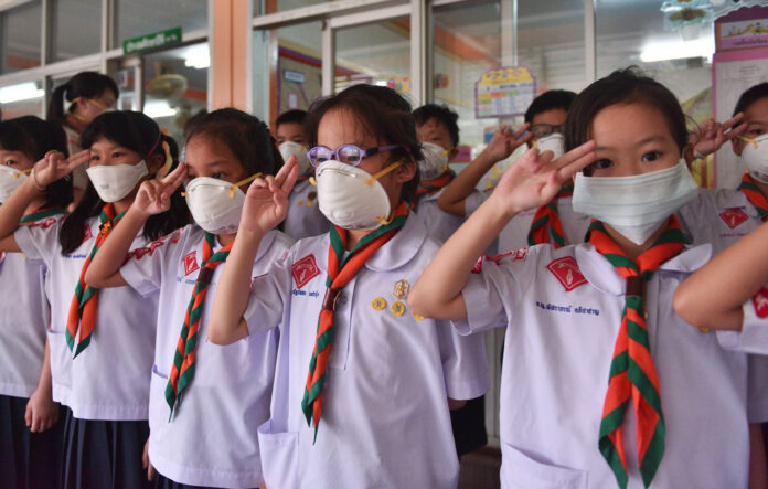 Students wear masks at at Patai Udom Suksa School on Jan. 15 in Bangkok, where all outdoor activities and physical education classes were canceled. Students wear masks at at Patai Udom Suksa School on Jan. 15 in Bangkok, where all outdoor activities and physical education classes were canceled.