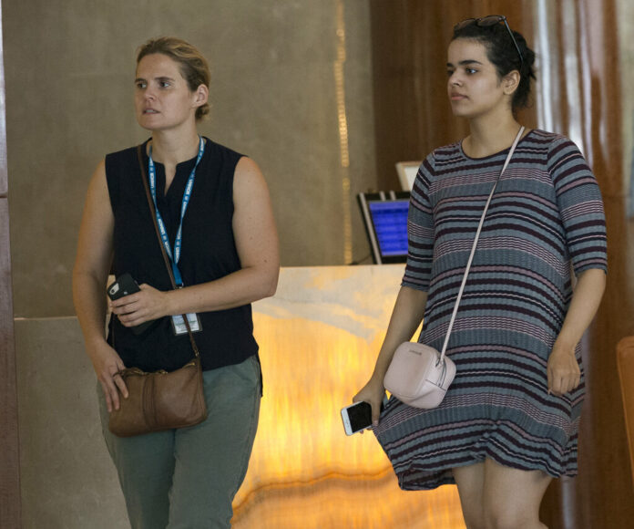 Rahaf Mohammed Alqunun, at right, walks with an unidentified woman Friday in Bangkok. Photo: Sakchai Lalit / Associated Press Rahaf Mohammed Alqunun, at right, walks with an unidentified woman Friday in Bangkok. Photo: Sakchai Lalit / Associated Press