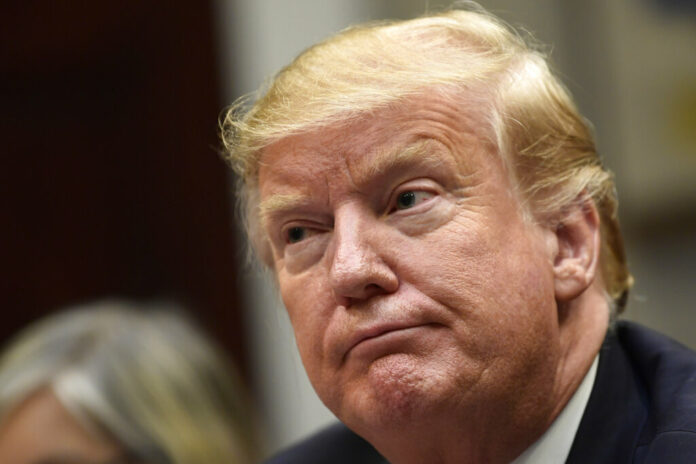 US President Donald Trump listens during a meeting with Hispanic pastors Friday in the Roosevelt Room of the White House. Photo: Susan Walsh / Associated Press