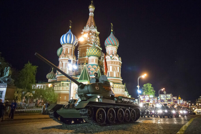 A World War II-era Soviet T-34 tank makes its way through the Red Square with the St. Basil's Cathedral in background, in May 2018 during a rehearsal for the Victory Day military parade in Moscow. Photo: Alexander Zemlianichenko / Associated Press