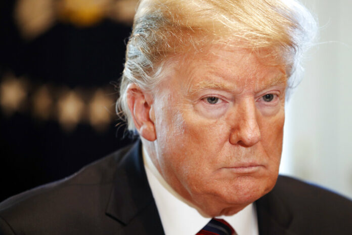 US President Donald Trump attends a round table discussion on border security with local leaders in January in the Cabinet Room of the White House. Photo: Jacquelyn Martin / Associated Press