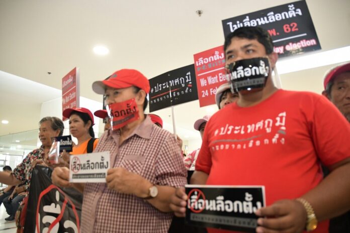 Pro-democracy activists stage a protest Monday at Election Commission to demand an election be held in February.