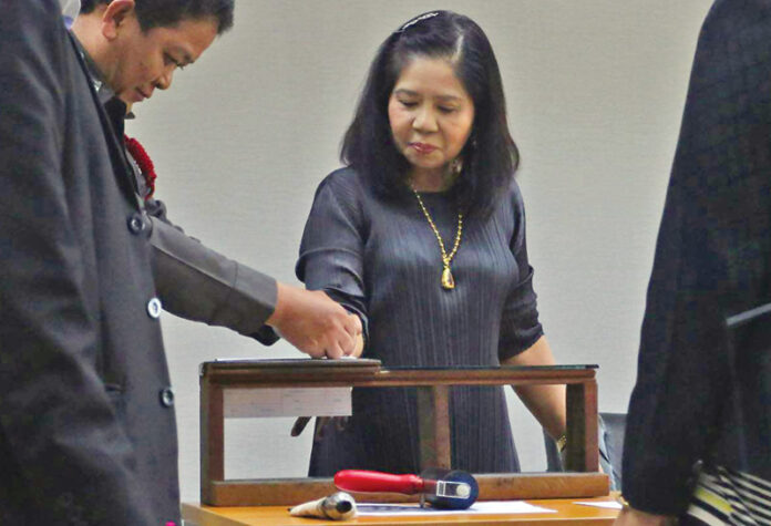 Monta Yokrattanakan is fingerprinted upon her arrest in July 2016.