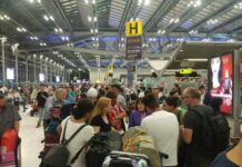 Thousands Stranded at BKK as Pakistan Shuts Airspace Passengers talk to a Thai Airways staff member Wednesday night at Suvarnabhumi International Airport.