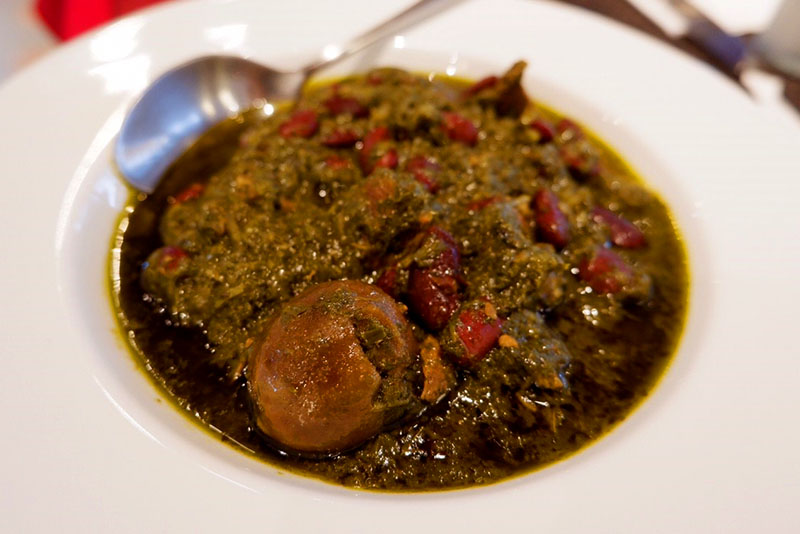 Khoresht ghormeh sabzi, a beef stew served with dried limes, kidney beans and fenugreek (250 baht).