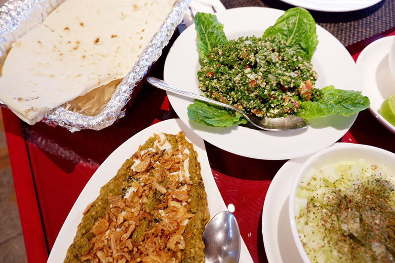 Clockwise from top left: Iranian naan (60 baht), tabouli (150 baht), masto khiar (80 baht) and kashk e bademjan (200 baht).