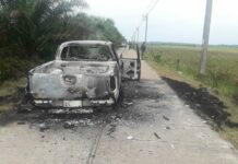 2 Narathiwat Police Shot Dead After Abduction Burnt wreckage of a truck used to kidnap two local policemen is seen Wednesday in Narathiwat province.