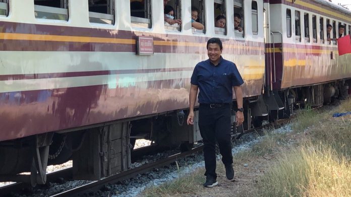 Chadchart Sittipunt walks along a railtrack in Bangkok on Jan. 27, 2019.
