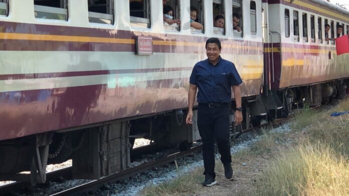 Chadchart Sittipunt walks along a railtrack in Bangkok on Jan. 27, 2019.