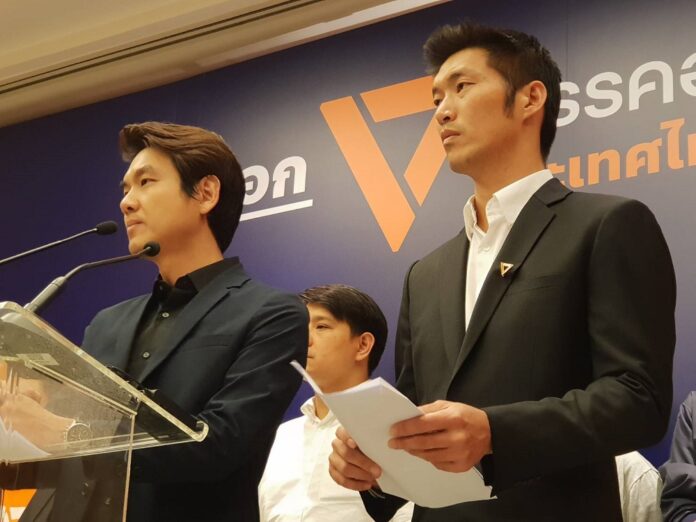 Future Forward Party leaders Piyabutr Saengkanokkul, front left, and Thanathorn Juangroongruangkit, speak at a Friday evening news conference in Bangkok.