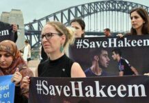 Australian Rallies Call for Thais to Free Bahraini Refugee This undated photo shows demonstrators holding up banners calling for the release of Hakeem Al-Araibi. Photo: Wanmai Phanomvan / Facebook